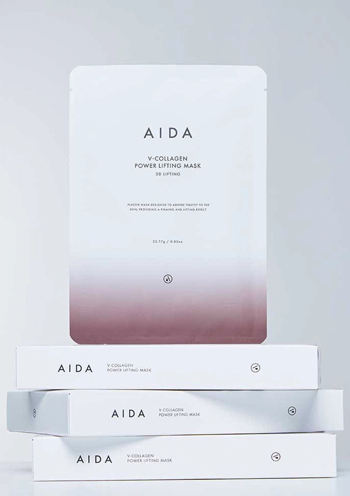 Stack of AIDA V-Collagen Power Lifting Mask boxes on a light gray background